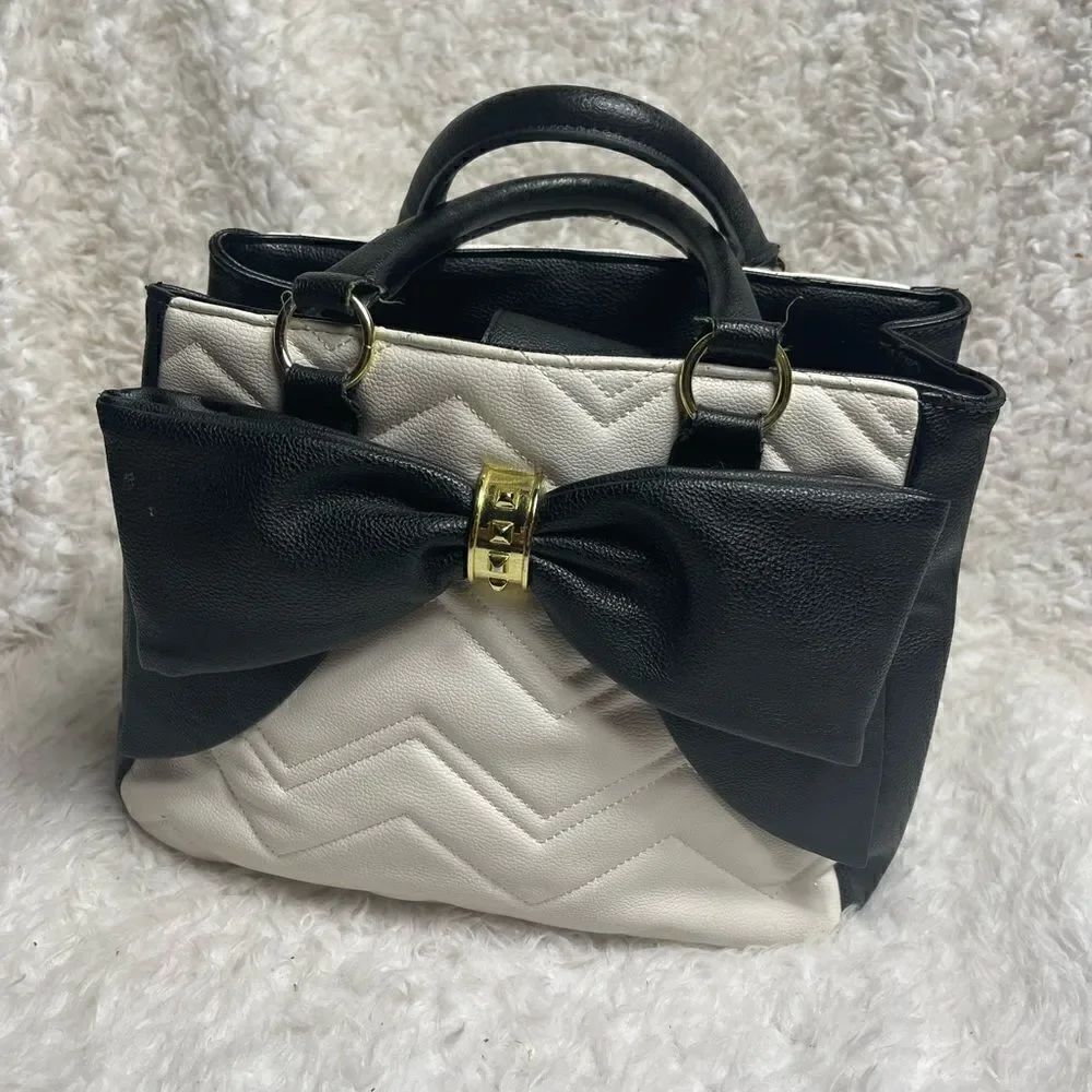 Betsey Johnson off white & Black quilted faux leather satchel with bow accent